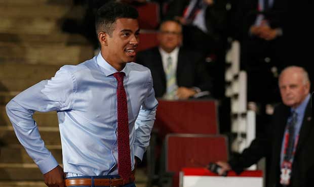 Pierre-Olivier Joseph walks to the stage after being selected by the Arizona Coyotes during the fir...