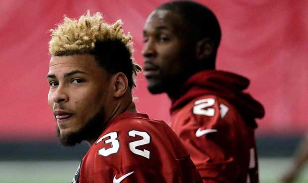 Arizona Cardinals' Tyrann Mathieu (32) and Patrick Peterson (21) watch drills during an NFL footbal...