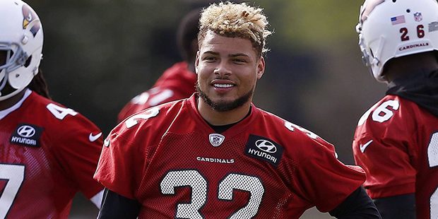 Arizona Cardinals defensive back Tyrann Mathieu waits his turn to run drills during an NFL football...