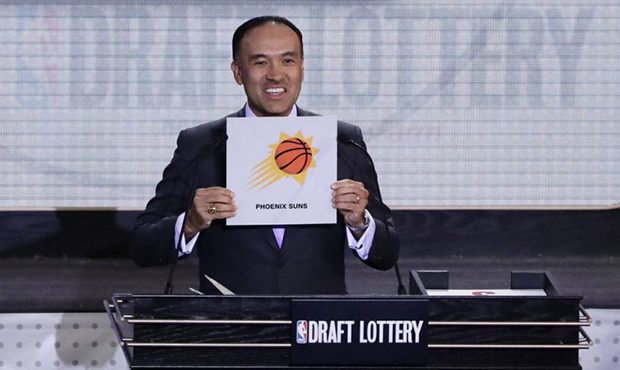 NBA Deputy Commissioner Mark Tatum announces the pick for the Phoenix Suns at the NBA basketball dr...