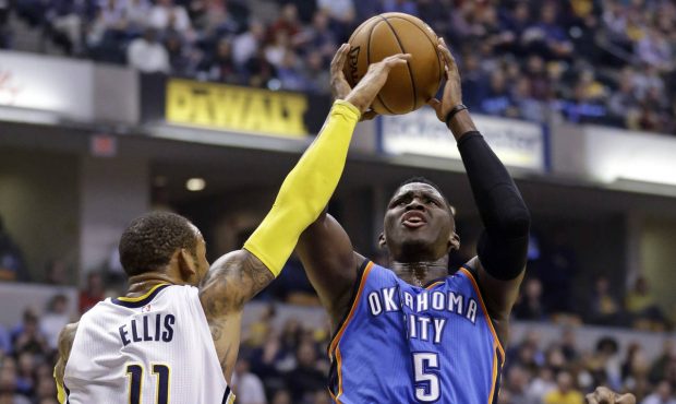 Oklahoma City Thunder guard Victor Oladipo (5) shoots over Indiana Pacers guard Monta Ellis (11) du...