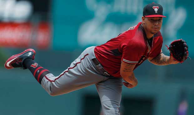 Arizona Diamondbacks starting pitcher Taijuan Walker delivers to Colorado Rockies' DJ LeMahieu in t...