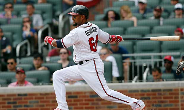 Atlanta Braves left fielder Emilio Bonifacio (64) bats against the San Diego Padres in a baseball g...