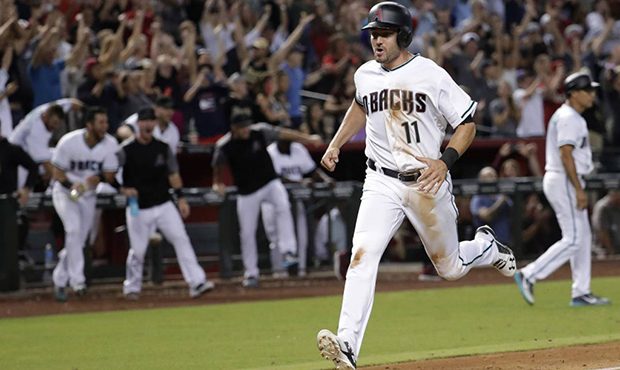 Arizona Diamondbacks' A.J. Pollock (11) scores the winning run on a single by Brandon Drury against...