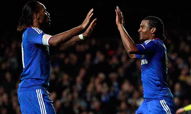 Chelsea's Florent Malouda, right, is congratulated by Didier Drogba after scoring the winning goal ...
