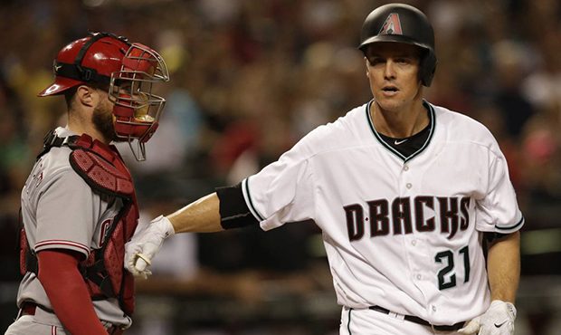 Arizona Diamondbacks Zack Greinke (21) reacts with Cincinnati Reds catcher Tucker Barnhart after ge...