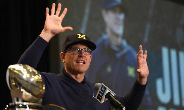 Michigan NCAA college football head coach Jim Harbaugh speaks at Big Ten Media Day in Chicago, Mond...