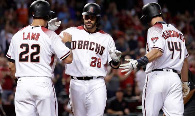 Arizona Diamondbacks' J.D. Martinez (28) celebrates his three run home run with Paul Goldschmidt (4...