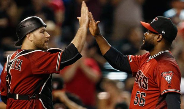 Arizona Diamondbacks' Fernando Rodney (56) gives a high-five to catcher Chris Iannetta, left, after...