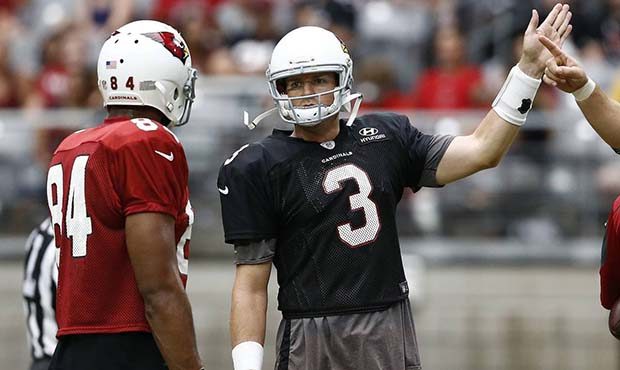 Arizona Cardinals quarterback Carson Palmer (3) talks with Jermaine Gresham (84) during NFL footbal...
