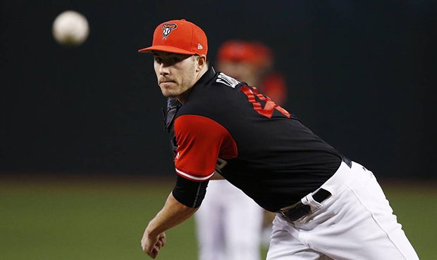 Arizona Diamondbacks' Patrick Corbin warms up a baseball game against the San Francisco Giants, Sun...