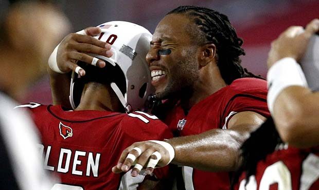 Arizona Cardinals wide receiver Larry Fitzgerald hugs teammate Brittan Golden (10) after Golden sco...
