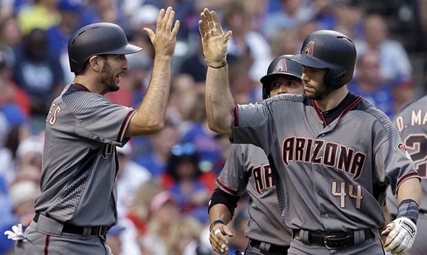 Arizona Diamondbacks' Paul Goldschmidt, right, celebrates with Adam Rosales after hitting a three-r...