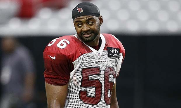 Arizona Cardinals linebacker Karlos Dansby pauses on the sidelines during an NFL football training ...