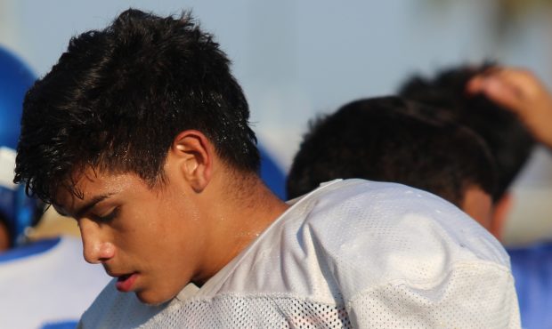 Albert Buelna of Buckeye Union High School listens to rap music before football games. Studies have...