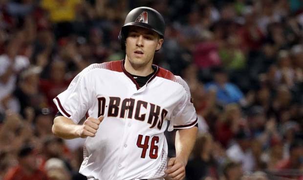 Arizona Diamondbacks' Patrick Corbin scores on a base hit by Jake Lamb during the fourth inning of ...
