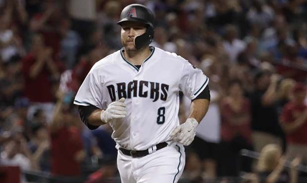 Arizona Diamondbacks catcher Chris Iannetta (8) rounds the bases after hitting a solo home run agai...