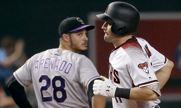 Arizona Diamondbacks' A.J. Pollock rounds the bases after hitting a three-run home run as Colorado ...