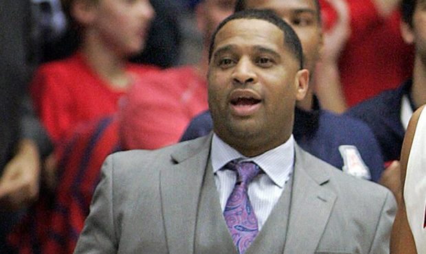 FILE - In this Dec. 11, 2013, file photo, Arizona's assistant coach Emanuel Richardson watches from...