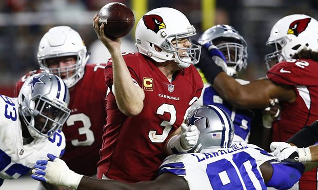 Arizona Cardinals quarterback Carson Palmer (3) is sacked by Dallas Cowboys defensive end Demarcus ...