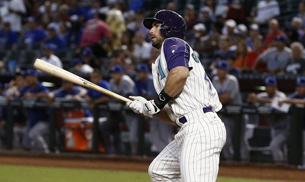 Arizona Diamondbacks' Paul Goldschmidt watches the flight of his two-run double against the Los Ang...