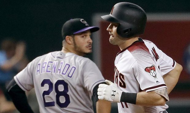 Arizona Diamondbacks' A.J. Pollock rounds the bases after hitting a three-run home run as Colorado ...