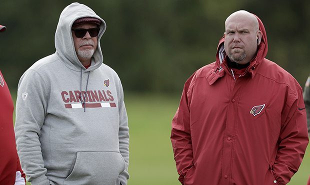 Arizona Cardinals' head coach Bruce Arians, center, supervises an NFL training session with general...