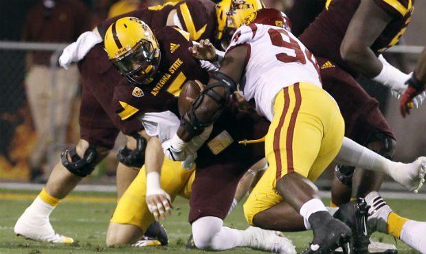 Arizona State quarterback Manny Wilkins (5) is sacked by Southern California defensive lineman Rash...