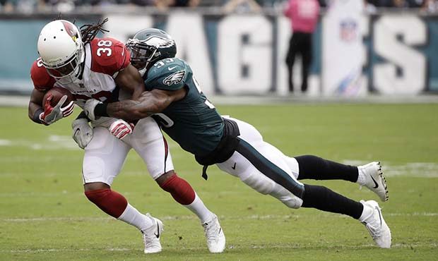 Arizona Cardinals' Andre Ellington, left, is tackled by Philadelphia Eagles' Nigel Bradham during t...
