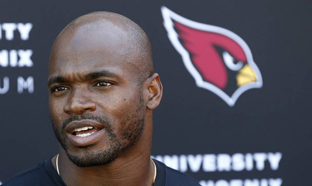 New Arizona Cardinals running back Adrian Peterson answers a question during an NFL football news c...