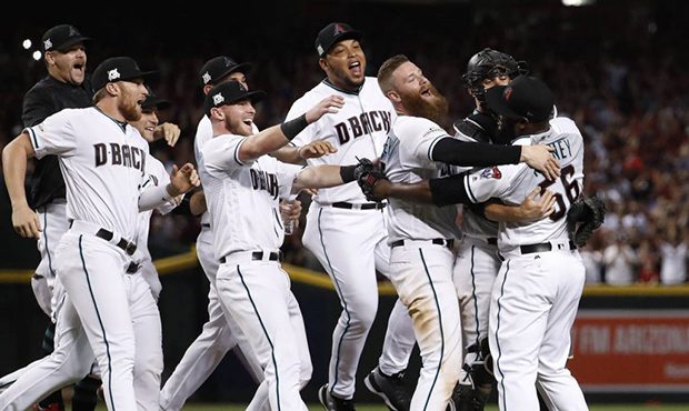 The Arizona Diamondbacks celebrate after the National League wild-card playoff baseball game agains...
