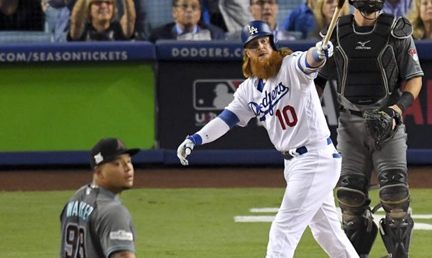 Arizona Diamondbacks starting pitcher Taijuan Walker, left, and Los Angeles Dodgers' Justin Turner ...