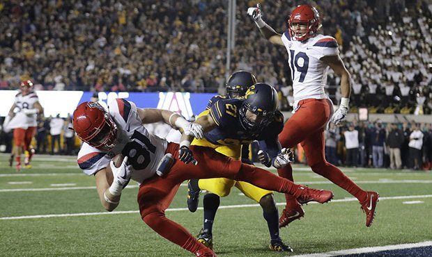 Arizona tight end Bryce Wolma (81) catches a touchdown pass next to California cornerback Ashtyn Da...