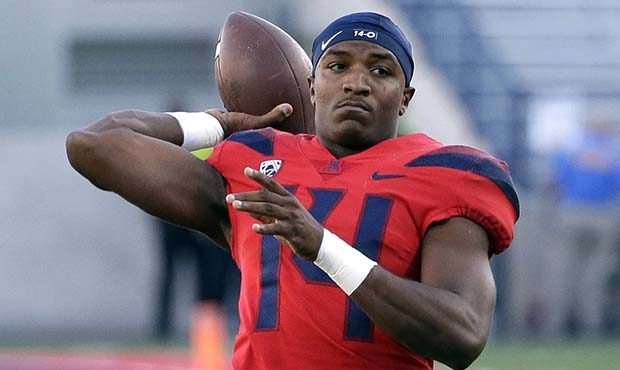 Arizona quarterback Khalil Tate warms up before an NCAA college football game against Arizona, Satu...