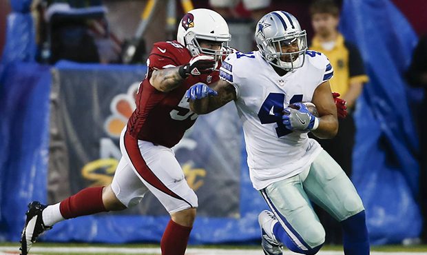 Dallas Cowboys fullback Keith Smith (41) runs away from Arizona Cardinals inside linebacker Scooby ...