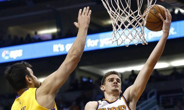 Phoenix Suns forward Dragan Bender, right, drives past Los Angeles Lakers center Andrew Bogut (66) ...