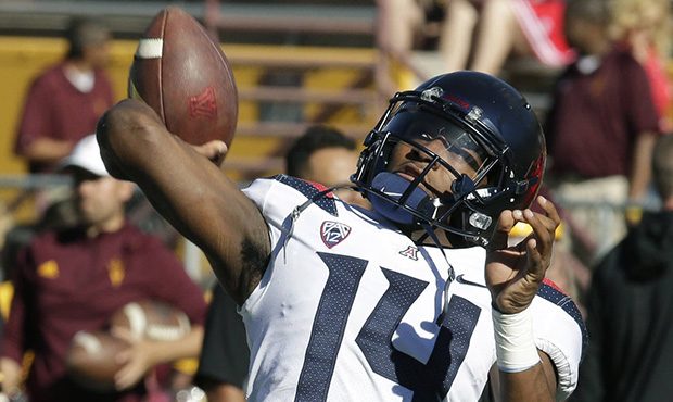 Arizona quarterback Khalil Tate warms up before an NCAA college football game against Arizona State...