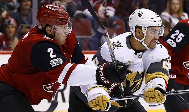 Arizona Coyotes defenseman Luke Schenn (2) tangles with Vegas Golden Knights left wing William Carr...