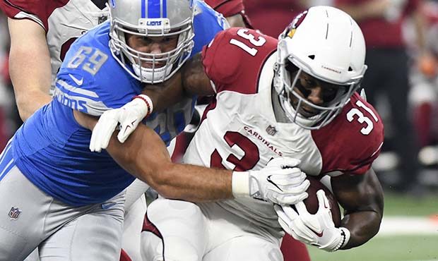 Detroit Lions defensive tackle Anthony Zettel (69) stops Arizona Cardinals running back David Johns...