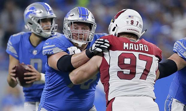 Detroit Lions offensive guard T.J. Lang (76) blocks Arizona Cardinals defensive end Josh Mauro (97)...