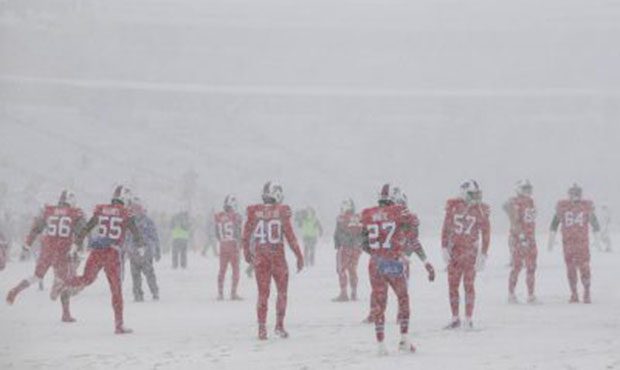 The Buffalo Bills warm-up in near white-out conditions before an NFL football game between the Buff...