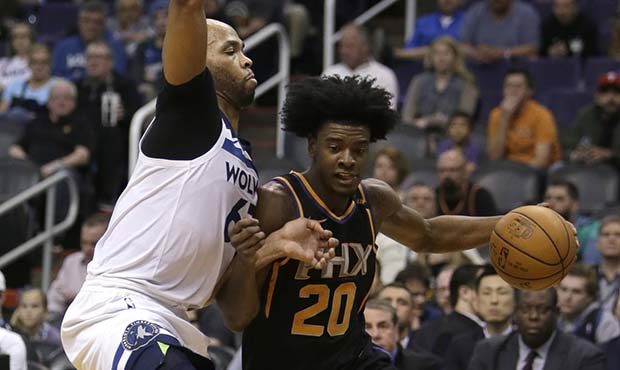 Phoenix Suns forward Josh Jackson (20) drives  against Minnesota Timberwolves forward Taj Gibson in...