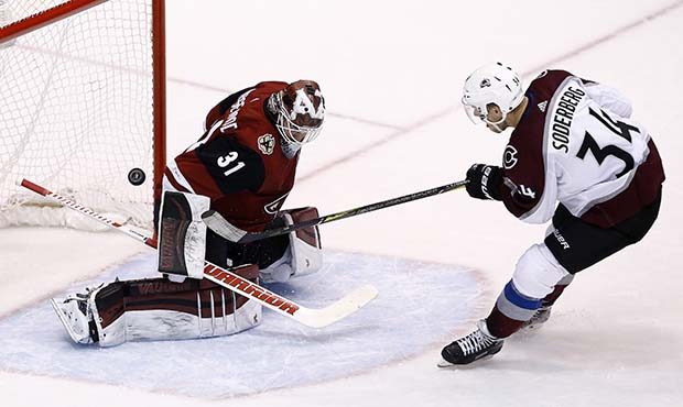 Colorado Avalanche center Carl Soderberg (34) scores a goal against Arizona Coyotes goalie Scott We...