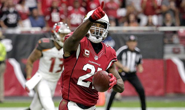 Arizona Cardinals cornerback Patrick Peterson (21) points to the stands after intercepting a pass a...