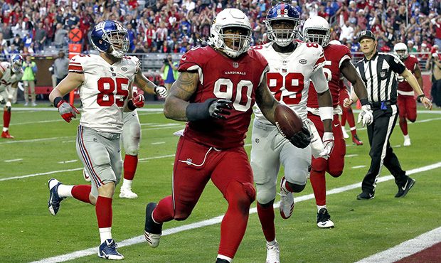 Arizona Cardinals defensive tackle Robert Nkemdiche (90) runs back a fumble recovery for a touchdow...