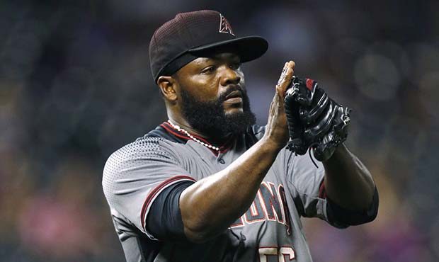 Arizona Diamondbacks relief pitcher Fernando Rodney applauds after retiring Colorado Rockies' Jonat...