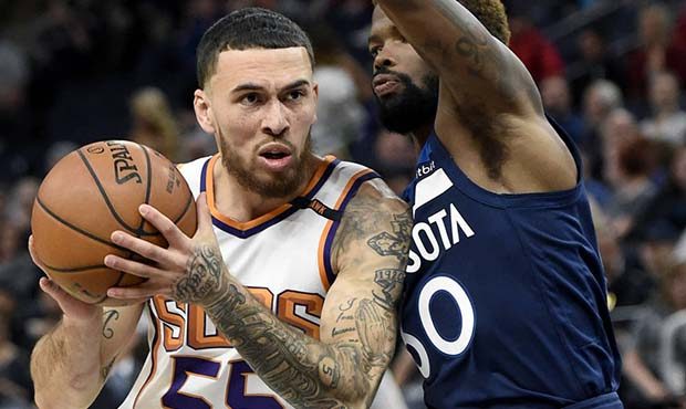 Phoenix Suns guard Mike James (55) drives against Minnesota Timberwolves guard Aaron Brooks (30) du...
