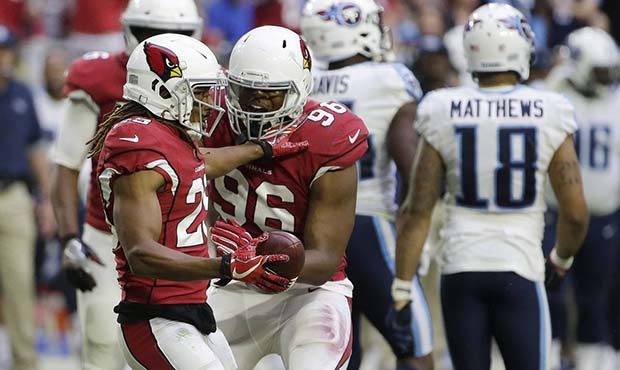 Arizona Cardinals defensive back Tramon Williams, left, celebrates his interception against against...
