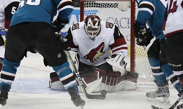 Arizona Coyotes goaltender Scott Wedgewood (31) blocks a shot at goal by the San Jose Sharks during...