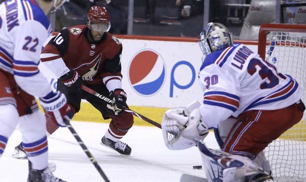 Arizona Coyotes left wing Anthony Duclair (10) drives against New York Rangers goaltender Henrik Lu...